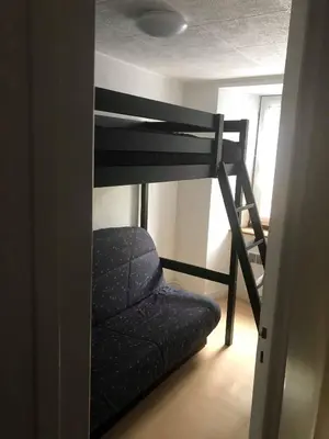 Un ou plusieurs lits dans un hébergement de l'établissement Joli appartement à Murat proche du Lioran Cantal