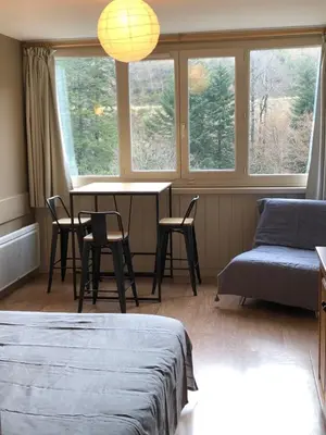 Coin salon dans l'établissement La Randonnée Résidence Le Bec de L'Aigle