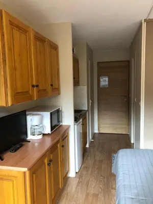 Cuisine ou kitchenette dans l'établissement La Randonnée Résidence Le Bec de L'Aigle