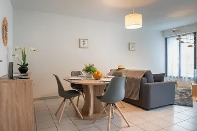 Coin salon dans l'établissement Le Reflet Citadin - 1 Chambre