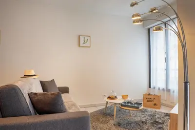 Coin salon dans l'établissement Le Reflet Citadin - 1 Chambre