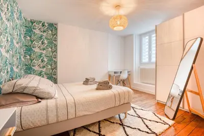 Un ou plusieurs lits dans un hébergement de l'établissement Maison bourgeoise Haussmannienne - Gîtes de France