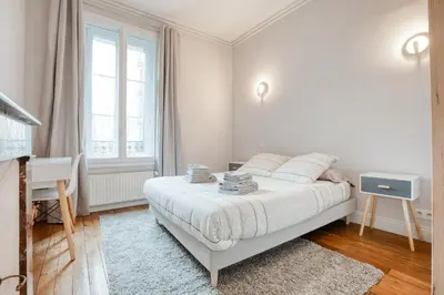 Un ou plusieurs lits dans un hébergement de l'établissement Maison bourgeoise Haussmannienne - Gîtes de France