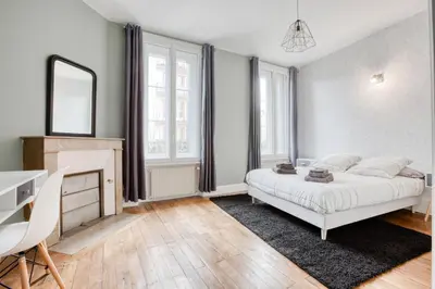 Un ou plusieurs lits dans un hébergement de l'établissement Maison bourgeoise Haussmannienne - Gîtes de France