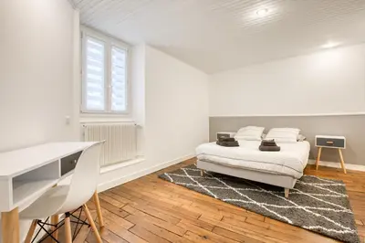 Un ou plusieurs lits dans un hébergement de l'établissement Maison bourgeoise Haussmannienne - Gîtes de France