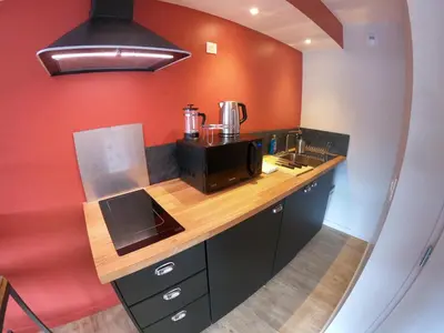 Cuisine ou kitchenette dans l'établissement Logis Hôtel Restaurant Beau Site