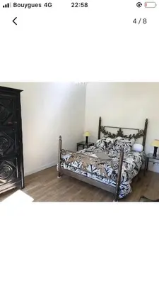 Un ou plusieurs lits dans un hébergement de l'établissement Maison cocooning avec petit jardin privatif
