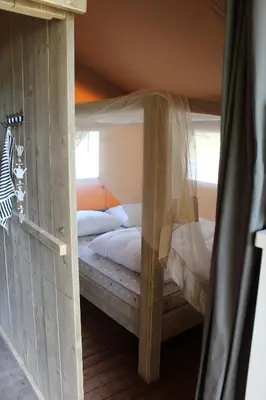 Un ou plusieurs lits dans un hébergement de l'établissement Glamping Lac du Causse