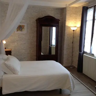 Un ou plusieurs lits dans un hébergement de l'établissement French Holiday Accommodation