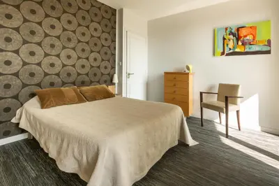 Un ou plusieurs lits dans un hébergement de l'établissement Chambre BEAUSEJOUR