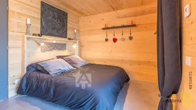 Un ou plusieurs lits dans un hébergement de l'établissement Chalet des Marmottes