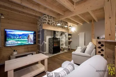 Télévision ou salle de divertissement dans l'établissement Gîte du Père François