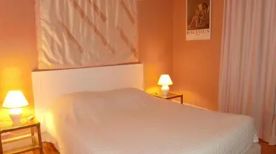 Un ou plusieurs lits dans un hébergement de l'établissement L OUSTALOU MAISON D HOTES DE CHARME EN AUVERGNE PISCINE PRIVEE CHAUFFéE