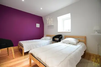 Un ou plusieurs lits dans un hébergement de l'établissement Villa Ballat's Dine