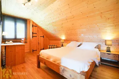 Un ou plusieurs lits dans un hébergement de l'établissement Chalet de Solène