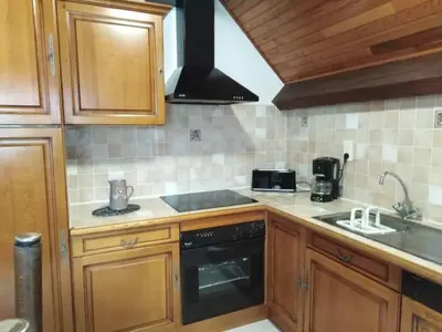 Cuisine ou kitchenette dans l'établissement Location de la cascade 8 personnes
