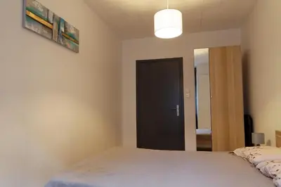 Un ou plusieurs lits dans un hébergement de l'établissement Villa Jean Julien - Le Sancy - Wifi - 2 chambres - 2 Salles d'eau - Rdc - 8 personnes - Terrasse