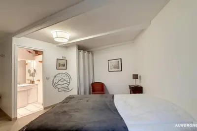 Un ou plusieurs lits dans un hébergement de l'établissement Gîte des Remparts