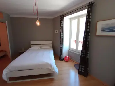 Un ou plusieurs lits dans un hébergement de l'établissement Tulle : bel appartement lumineux en centre ville