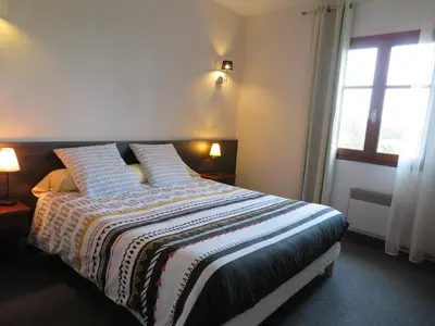 Un ou plusieurs lits dans un hébergement de l'établissement Auberge d'ici et d'ailleurs