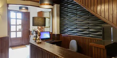 Télévision ou salle de divertissement dans l'établissement Auberge d'ici et d'ailleurs
