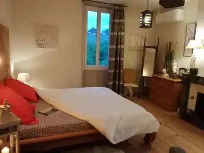 Un ou plusieurs lits dans un hébergement de l'établissement La maison O kiwis - Chambres d'hôtes