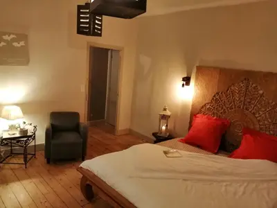 Un ou plusieurs lits dans un hébergement de l'établissement La maison O kiwis - Chambres d'hôtes