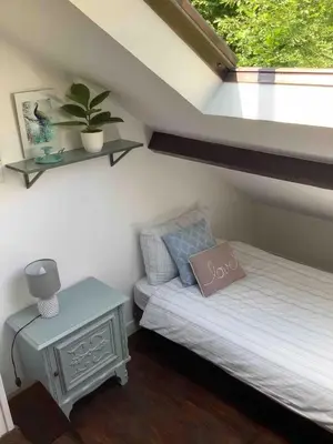 Un ou plusieurs lits dans un hébergement de l'établissement Woodland Cottage