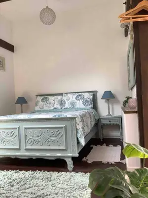 Un ou plusieurs lits dans un hébergement de l'établissement Woodland Cottage