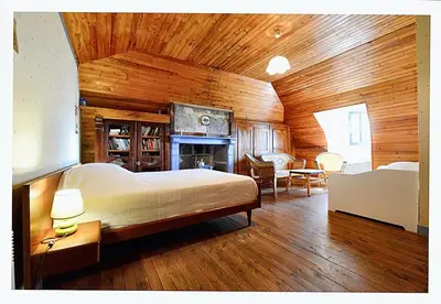 Un ou plusieurs lits dans un hébergement de l'établissement Maison confortable avec vue sur la montagne à Le Fau