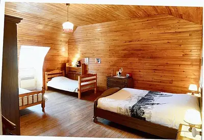 Un ou plusieurs lits dans un hébergement de l'établissement Maison confortable avec vue sur la montagne à Le Fau