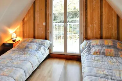 Un ou plusieurs lits dans un hébergement de l'établissement Villa ravissante à Loubressac avec piscine privée