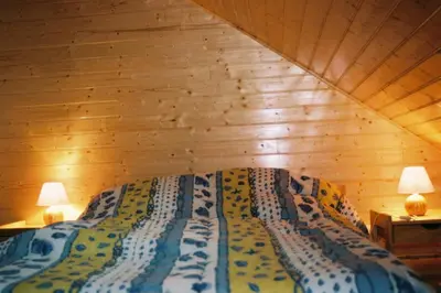 Un ou plusieurs lits dans un hébergement de l'établissement chalet jennifer