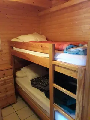 Un ou plusieurs lits dans un hébergement de l'établissement chalet cathy