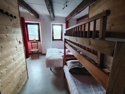 Un ou plusieurs lits dans un hébergement de l'établissement Maison de montagne