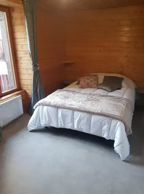 Un ou plusieurs lits dans un hébergement de l'établissement Le cocon du sancy