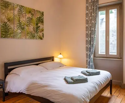 Un ou plusieurs lits dans un hébergement de l'établissement La Villa François Premier