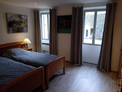 Un ou plusieurs lits dans un hébergement de l'établissement Maison Village Hautefage