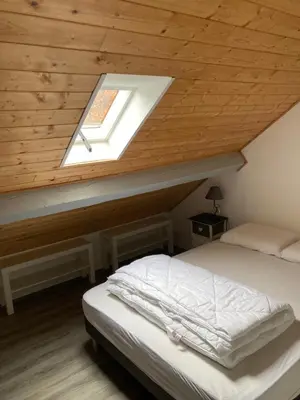 Un ou plusieurs lits dans un hébergement de l'établissement Appartement F3