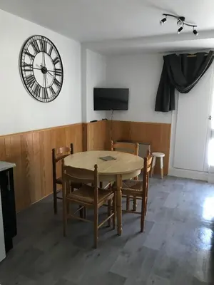 Télévision ou salle de divertissement dans l'établissement Appartement au pied des pistes
