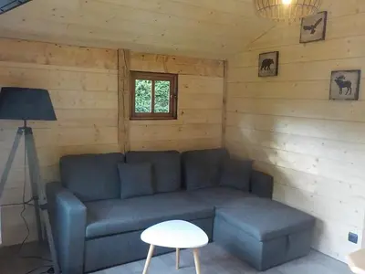 Coin salon dans l'établissement Chalet des cascades