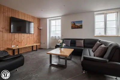 Télévision ou salle de divertissement dans l'établissement Gîte de Granit GRIS