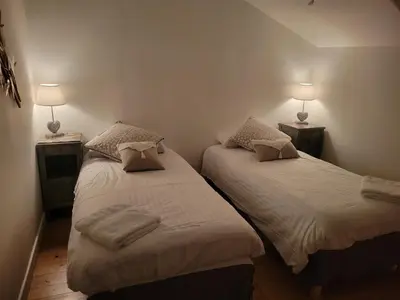Un ou plusieurs lits dans un hébergement de l'établissement Les hauts Brianço
