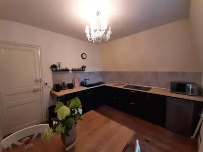 Cuisine ou kitchenette dans l'établissement Chateau Sourliavoux, appartement en chambres d'hôtes