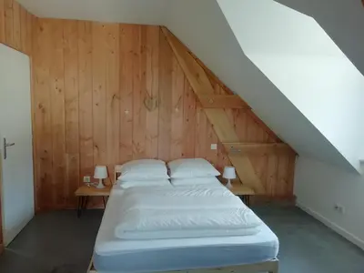 Un ou plusieurs lits dans un hébergement de l'établissement Gîte de Granit Noir