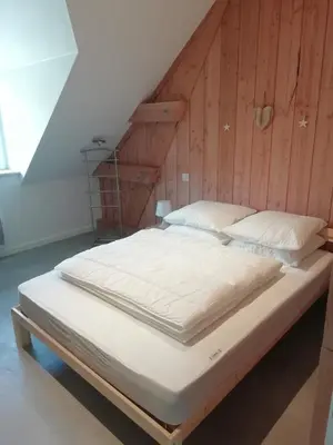Un ou plusieurs lits dans un hébergement de l'établissement Gîte de Granit Noir