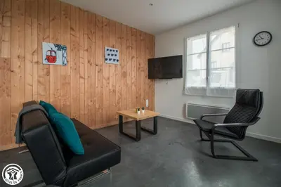 Télévision ou salle de divertissement dans l'établissement Gîte de Granit Bleu