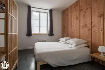 Un ou plusieurs lits dans un hébergement de l'établissement Gîte de Granit ROSE