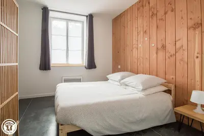 Un ou plusieurs lits dans un hébergement de l'établissement Gîte de Granit ROSE