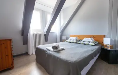 Un ou plusieurs lits dans un hébergement de l'établissement La Belle Arverne